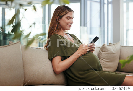 Phone, networking or pregnant business woman in office on social media, website or internet on couch. Maternity, technology or calm female designer with pregnancy or mobile app to scroll in workplace 138367499