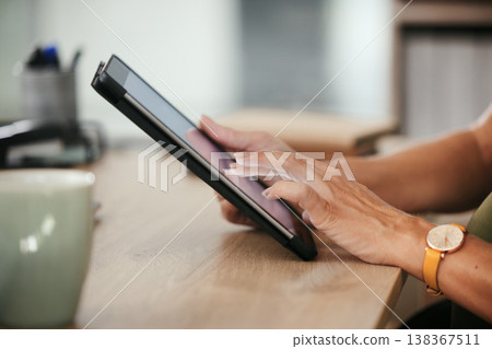 Tablet, hands and closeup of business woman in office doing research and reading information on internet. Online, career and female designer working on project with digital technology in workplace. Tablet, hands and closeup of business woman in office doing research and reading information on internet. Online, career and female designer working on project with digital technology in workplace. 138367511