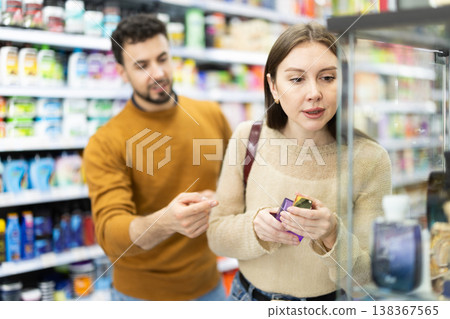 Couple spends time in store, looking for goods and select perfume 138367565