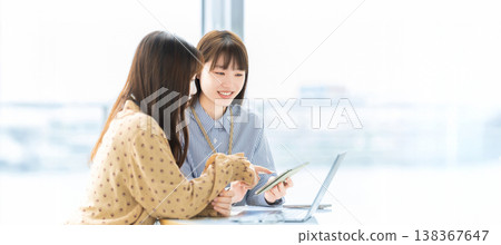 Two women/businesswomen having a meeting 138367647