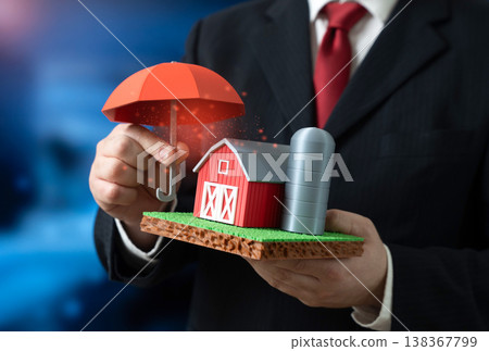 A businessman protects a farm with an umbrella symbolizing insurance. Agribusiness risk management. Crop protection, financial coverage, strategies support farming resilience and sustainability. A businessman protects a farm with an umbrella symbolizing insurance. Agribusiness risk management. Crop protection, financial coverage, strategies support farming resilience and sustainability. 138367799