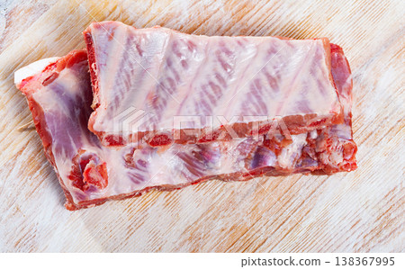 Raw pork ribs on wooden table Raw pork ribs on wooden table 138367995