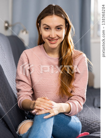 Woman relaxing on couch in livingroom room Woman relaxing on couch in livingroom room 138368284