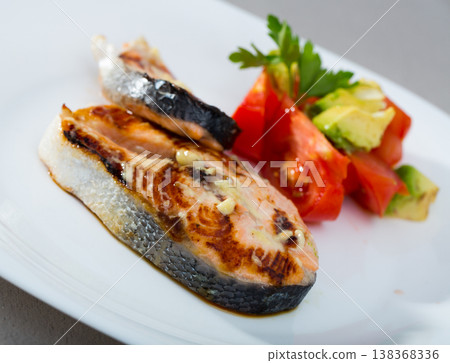 Grilled salmon steaks with vegetables Grilled salmon steaks with vegetables 138368336