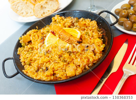 Seafood paella with lemon in pan Seafood paella with lemon in pan 138368353