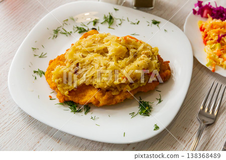 Grilled pork chop with sauerkraut - Polish dish 138368489