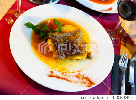 Tasty baked pork with potatoes and gravy 138368496