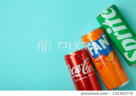 Mykolaiv, Ukraine - March 25, 2026: Iron cans of Coca Cola, Fanta and Sprite drink on blue background. 138368778