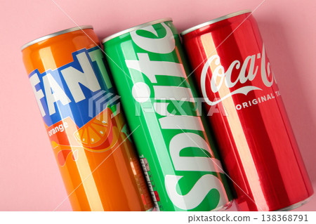 Mykolaiv, Ukraine - March 25, 2026: Iron cans of Coca Cola, Fanta and Sprite drink on pink background. Mykolaiv, Ukraine - March 25, 2026: Iron cans of Coca Cola, Fanta and Sprite drink on pink background. 138368791