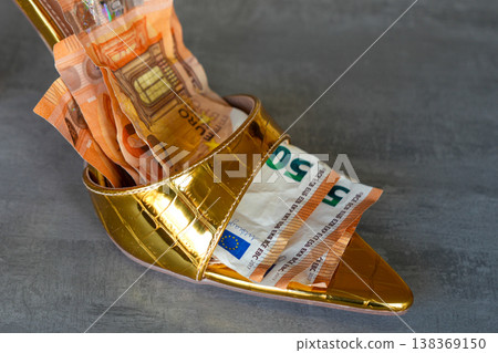 Sexy gold slip on high heel with euro banknotes inside luxury fashion and wealth concept shoe Sexy gold slip on high heel with euro banknotes inside luxury fashion and wealth concept shoe 138369150