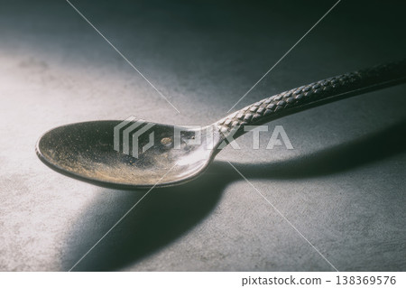 Adaptive cutlery designed as disability aid features textured handle for improved grip and comfort, enhancing independence and daily living for individuals with limited hand strength 138369576