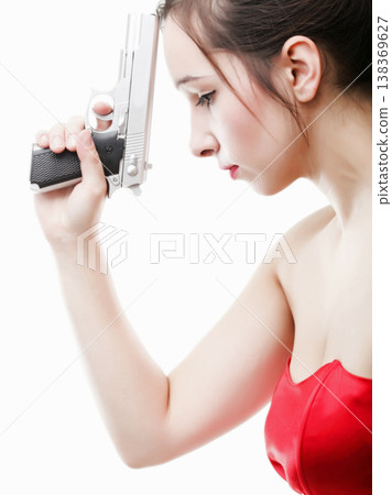 Sexy young woman - gun isolated on white 138369627