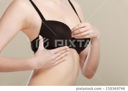 Girl getting comfortable in her bra Girl getting comfortable in her bra 138369746