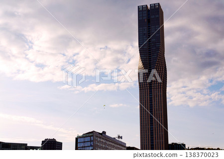 Paraglider with the tallest building in Scandinavia Karlatornet skycraper in Lindholmen, Gothenburg, Sweden, sunny day Paraglider with the tallest building in Scandinavia Karlatornet skycraper in Lindholmen, Gothenburg, Sweden, sunny day 138370023