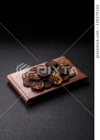 Organic Chinese green pu-erh tea with various herbs in round bricks. Chinese pu-erh tea Organic Chinese green pu-erh tea with various herbs in round bricks. Chinese pu-erh tea 138370102