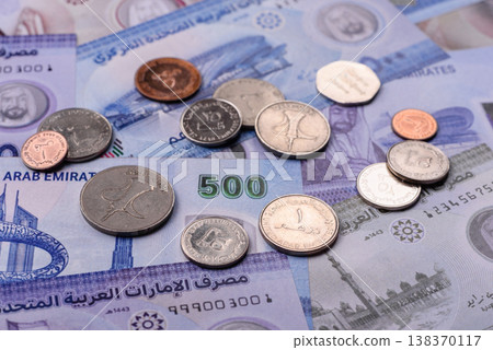 United Arab Emirates cash, dirhams and coins for exchange and financial transactions. UAE currency United Arab Emirates cash, dirhams and coins for exchange and financial transactions. UAE currency 138370117