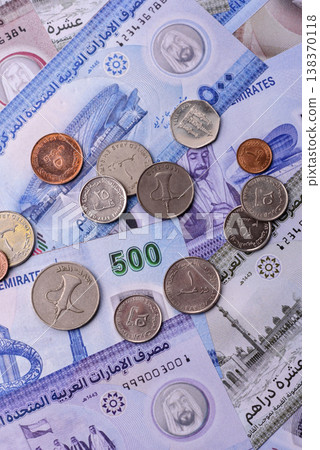 United Arab Emirates cash, dirhams and coins for exchange and financial transactions. UAE currency United Arab Emirates cash, dirhams and coins for exchange and financial transactions. UAE currency 138370118
