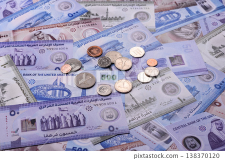 United Arab Emirates cash, dirhams and coins for exchange and financial transactions. UAE currency United Arab Emirates cash, dirhams and coins for exchange and financial transactions. UAE currency 138370120