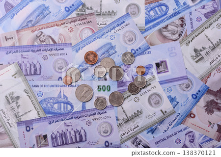 United Arab Emirates cash, dirhams and coins for exchange and financial transactions. UAE currency United Arab Emirates cash, dirhams and coins for exchange and financial transactions. UAE currency 138370121