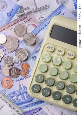United Arab Emirates cash, dirhams and coins for exchange and financial transactions. UAE currency United Arab Emirates cash, dirhams and coins for exchange and financial transactions. UAE currency 138370132