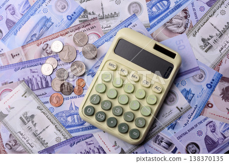 United Arab Emirates cash, dirhams and coins for exchange and financial transactions. UAE currency United Arab Emirates cash, dirhams and coins for exchange and financial transactions. UAE currency 138370135