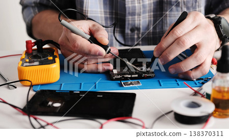 Master Fixing Broken Connector On Smartphone Board 138370311
