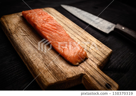 Raw salmon fillet on wooden table Raw salmon fillet on wooden table 138370319