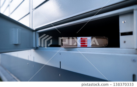 Package Delivery In Pickup Cell Of Parcel Automated Locker 138370333