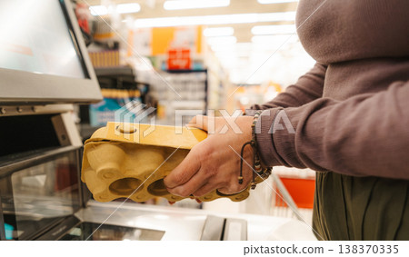Female Customer Scanning Eggs Products At Automated Checkout Station 138370335