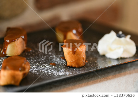 French pain perdu caramelized dessert with cream and sugar powder 138370626
