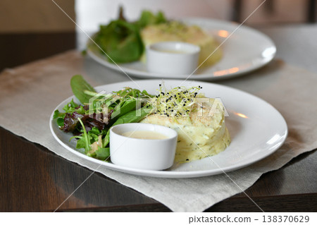 Elegant French seafood fish fillet with creamy sauce and greens Elegant French seafood fish fillet with creamy sauce and greens 138370629