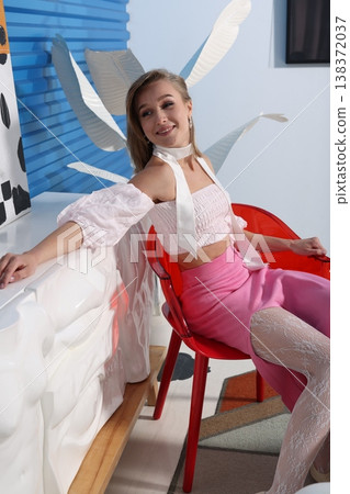 Relaxed studio environment with woman showcasing lifestyle content 138372037