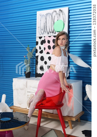 Cheerful woman displays beauty products with camera and decor Cheerful woman displays beauty products with camera and decor 138372038
