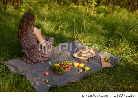 White woman immerses herself in serene countryside reflection and writing White woman immerses herself in serene countryside reflection and writing 138372126