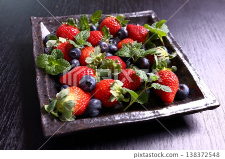 A platter of fresh strawberries and blueberries (berry mix) A platter of fresh strawberries and blueberries (berry mix) 138372548