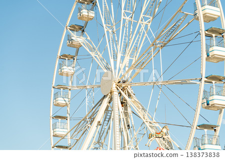 Ferris Wheel Stands Tall Against Clear Blue Sky Ferris Wheel Stands Tall Against Clear Blue Sky 138373838