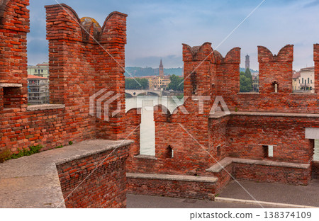 Scaliger Bridge walkway with red brick walls in Verona, Italy Scaliger Bridge walkway with red brick walls in Verona, Italy 138374109