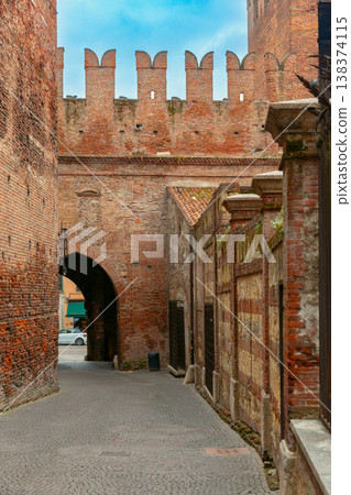 Scaliger Bridge walkway with red brick walls in Verona, Italy Scaliger Bridge walkway with red brick walls in Verona, Italy 138374115