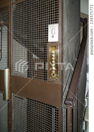 An old-fashioned cage elevator still remains in a hotel in Rome. 138375771