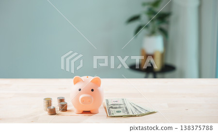 Piggy bank shows global economy, money, finance, growth and business, stock, economic concept depicts coins and bills to save and invest for future wealth management planning 138375788