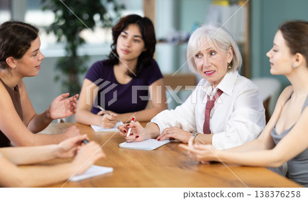 Female participate sit at circle, chatting, talking Female participate sit at circle, chatting, talking 138376258