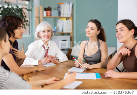 Female participate sit at circle, chatting, talking Female participate sit at circle, chatting, talking 138376367