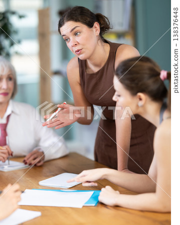 Female participate sit at circle, chatting, talking Female participate sit at circle, chatting, talking 138376448