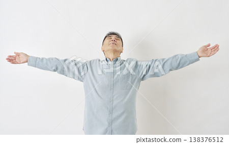 Man taking a deep breath on white background Man taking a deep breath on white background 138376512
