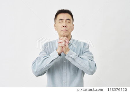 Man praying on white background Man praying on white background 138376520