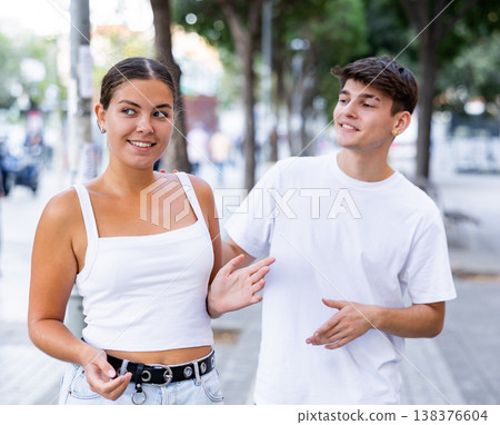 Young man trying to acquaint with girl outdoors Young man trying to acquaint with girl outdoors 138376604