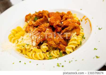 Italian fusilli pasta with pork and cheese Italian fusilli pasta with pork and cheese 138376674