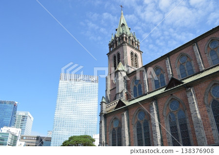 A view of Myeongdong Cathedral and skyscrapers in Seoul, South Korea. 138376908