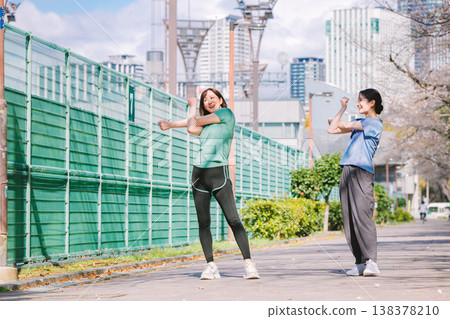 Woman warming up: stretching and warm-up exercises 138378210