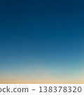 Photo of a beautiful clear evening sky without clouds. Sky gradient from orange to blue. 138378320